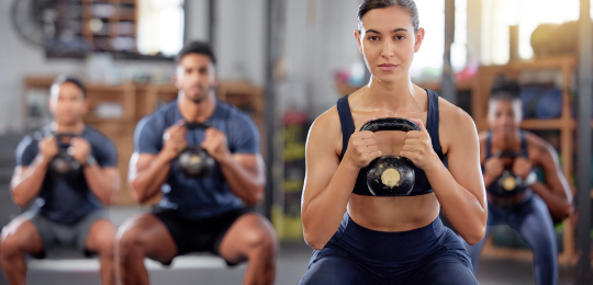 kettlebell-fitness-training-group-healthy-people-living-active-health-wellness-body-weight-watching-lifestyle-sports-team doing-workout-exercise-gym-class