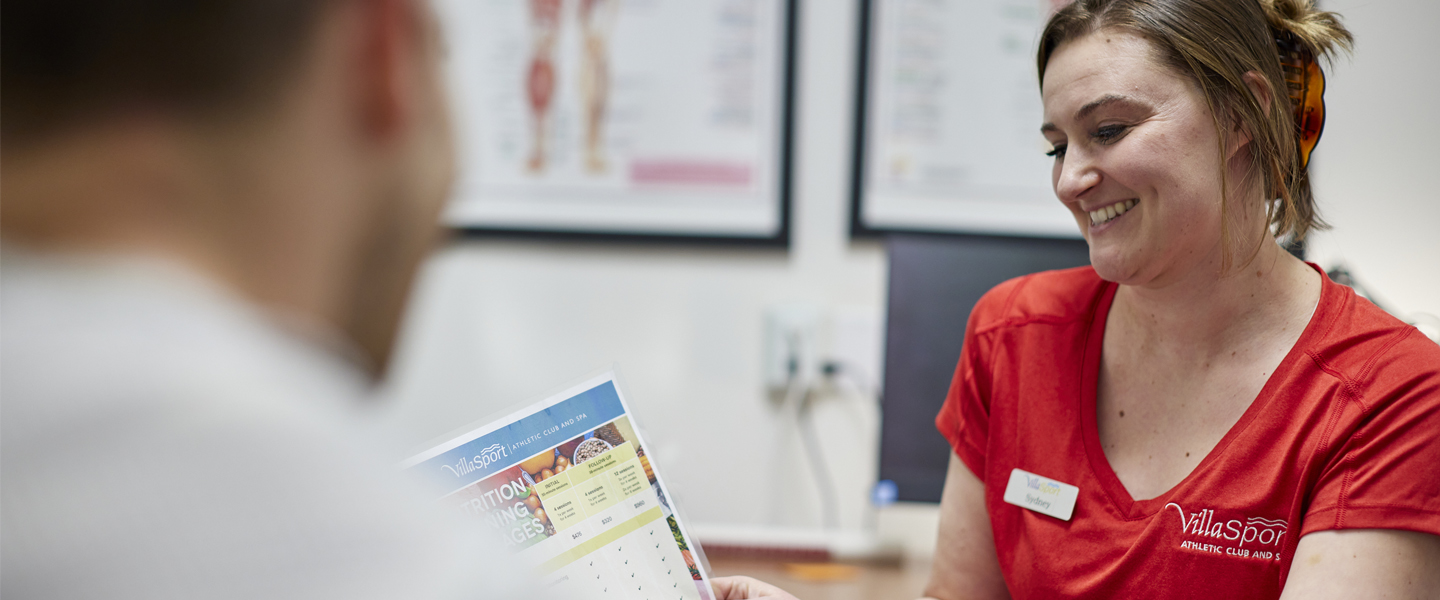 Personal Trainer reviewing a meal plan with a member