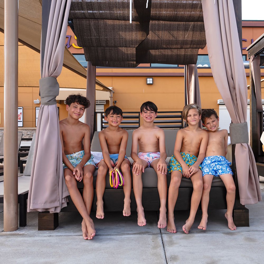 boys at the cabana poolside at villa sport
